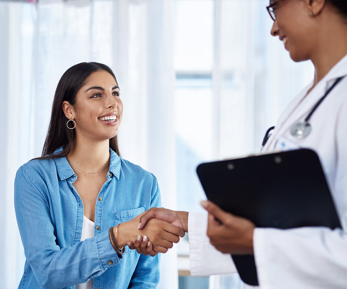 Gynecology Accent image showing a happy patient talking with a doctor